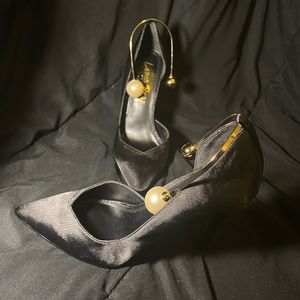 Black triangle pointed high heels